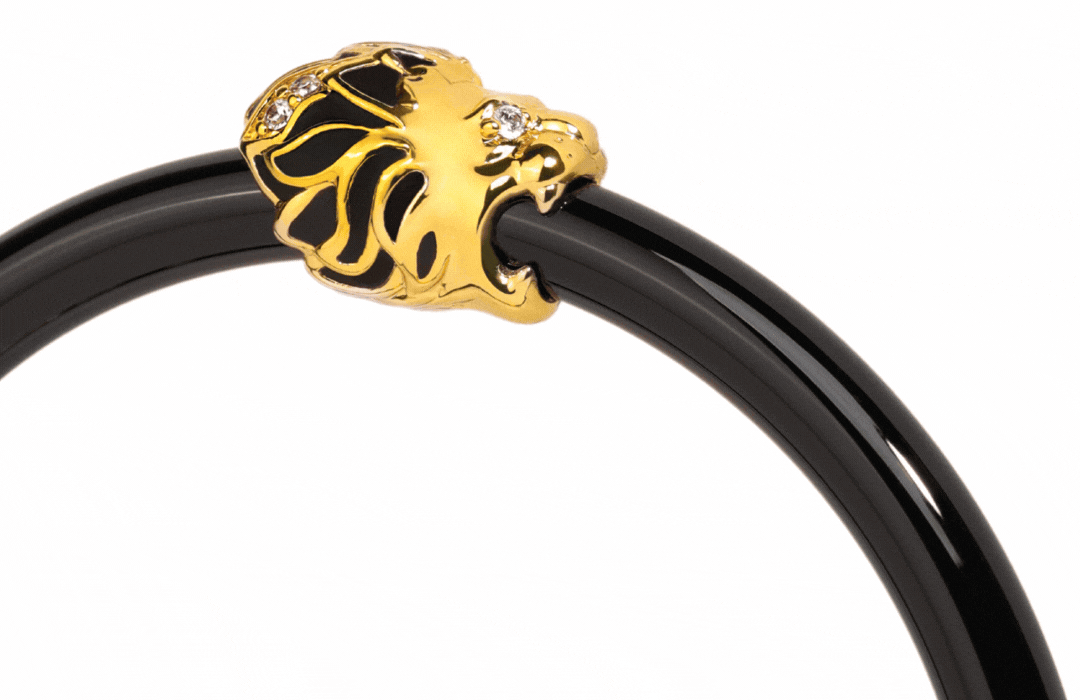 a close up of a black and gold object