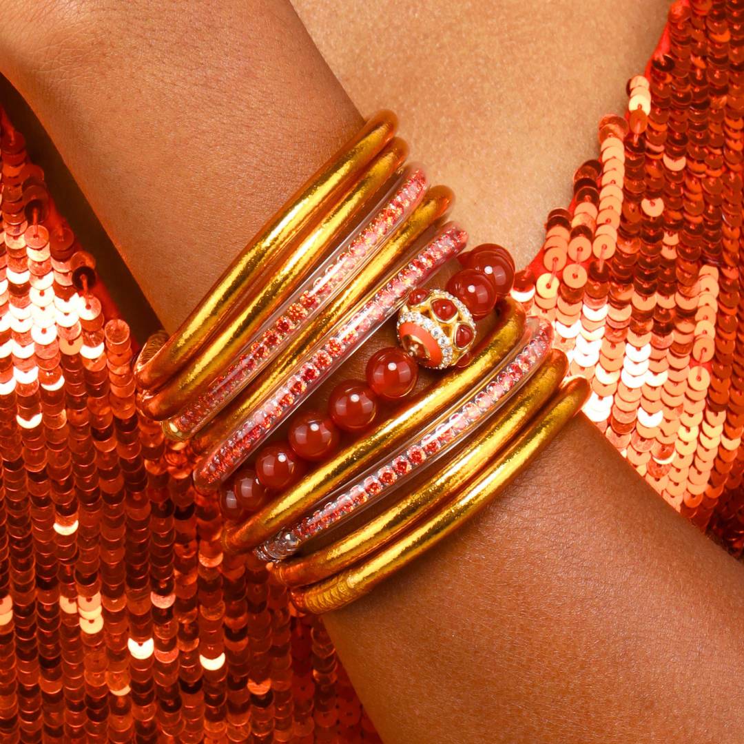 Orange Spark Collection Bracelets on Model Wearing Orange Sequin Dress | BuDhaGirl