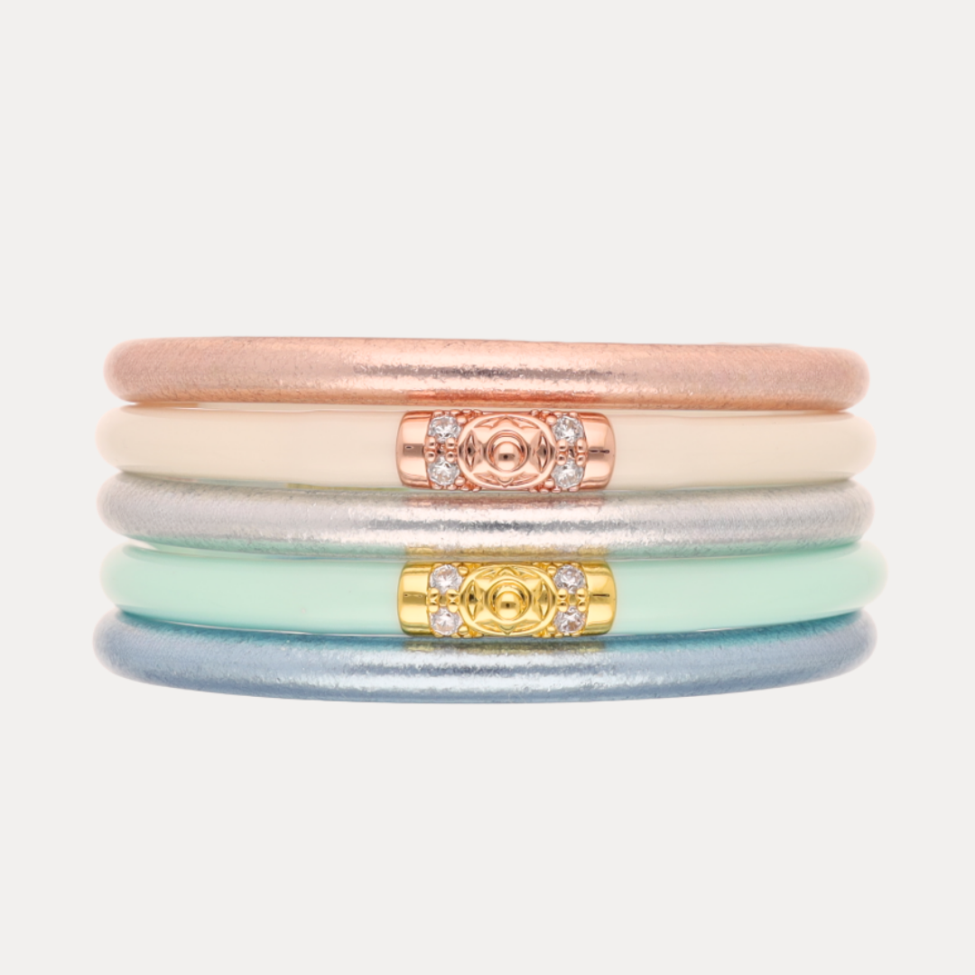 a stack of colorful bracelets