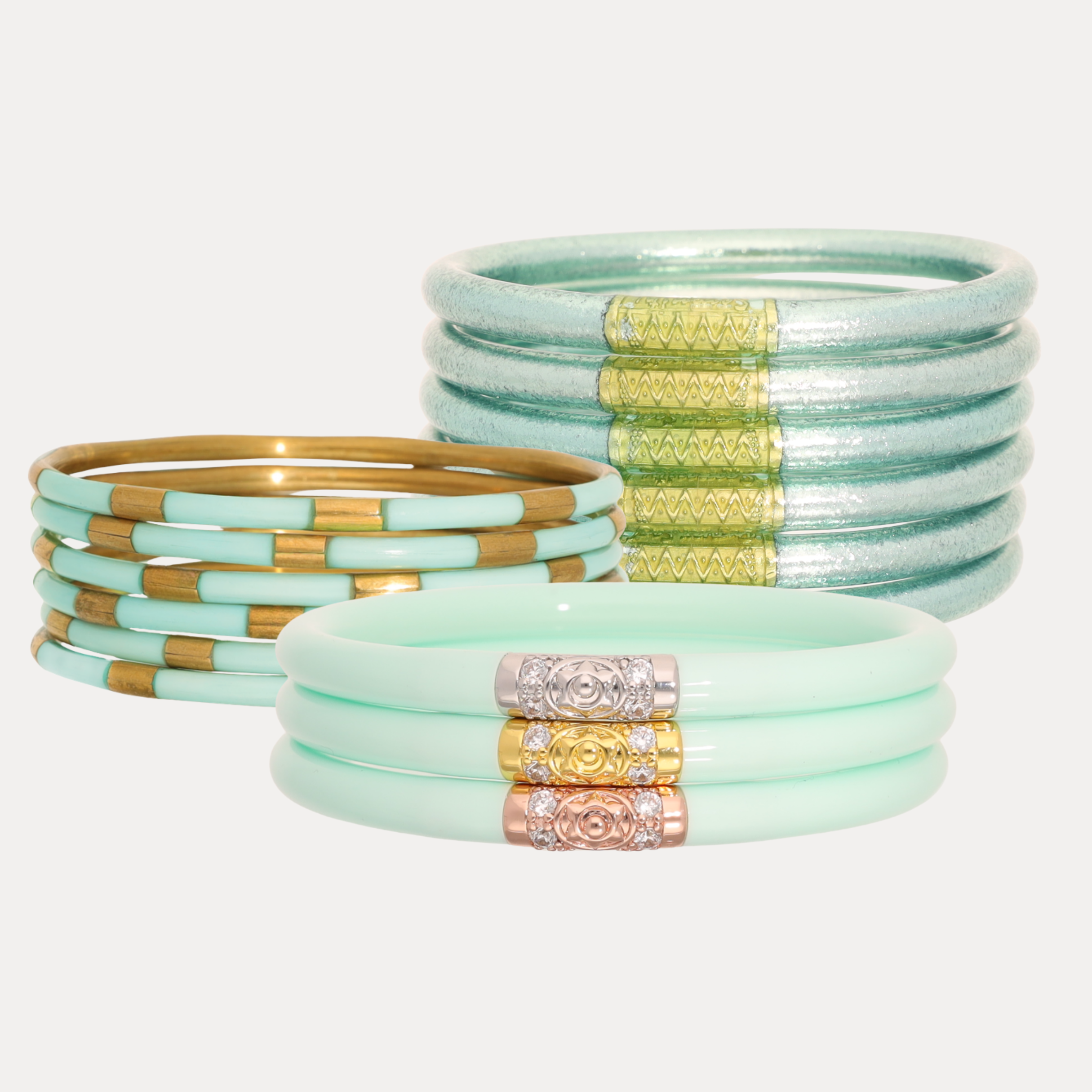 a group of bracelets with gold and silver accents