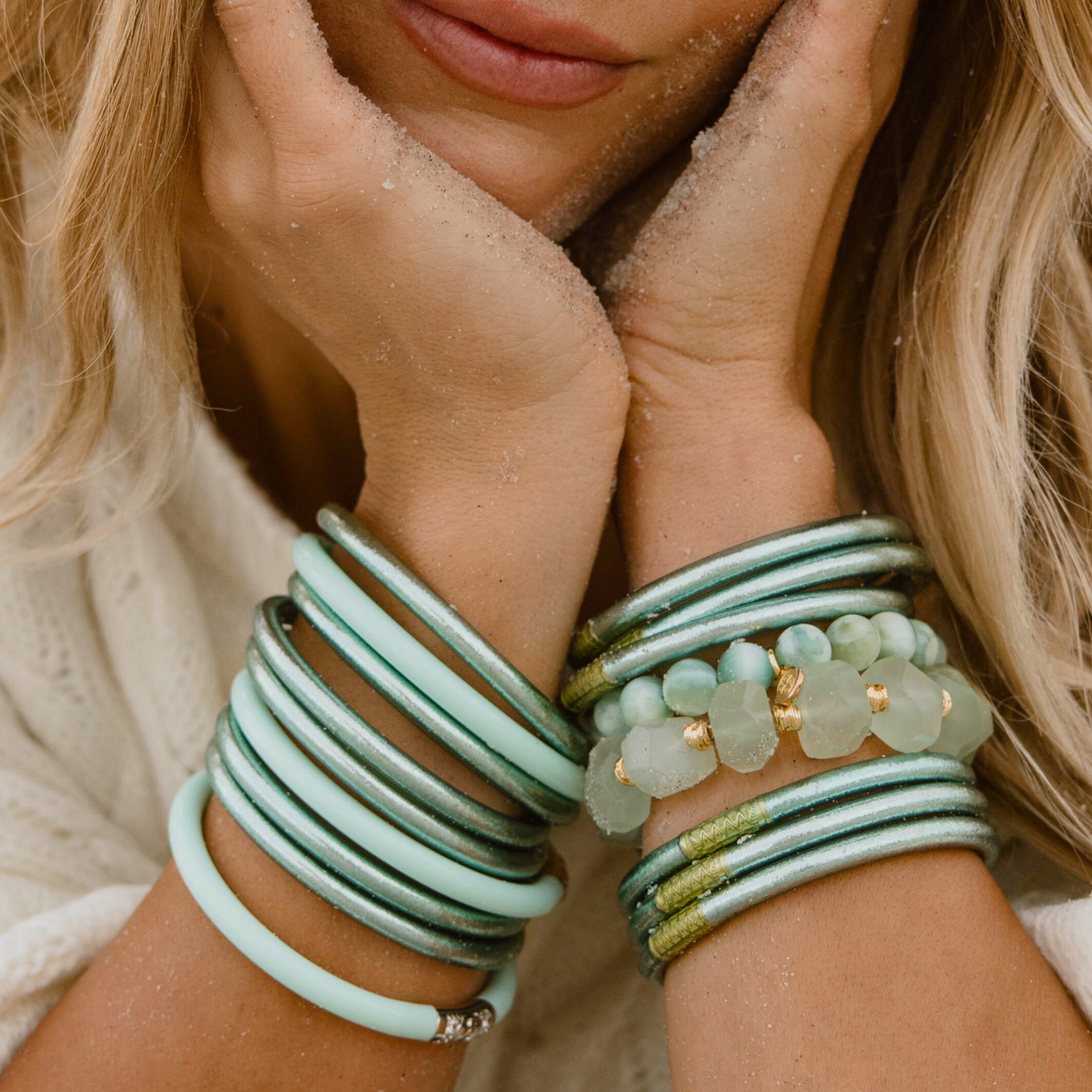 a woman with her hands on her face