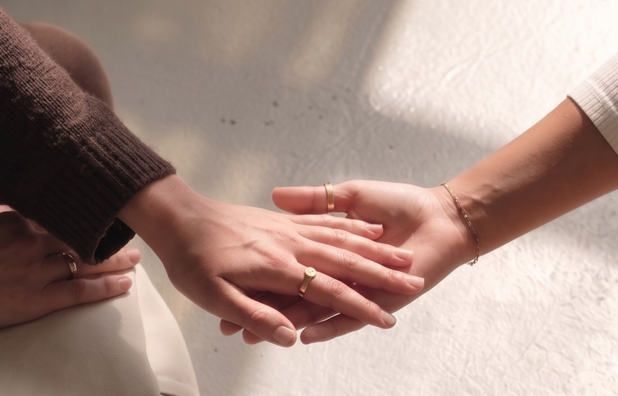 a close-up of a woman holding a hand