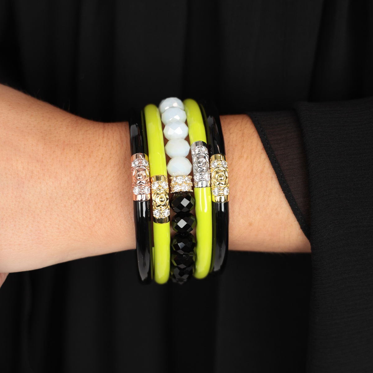 a person wearing bracelets on their wrist