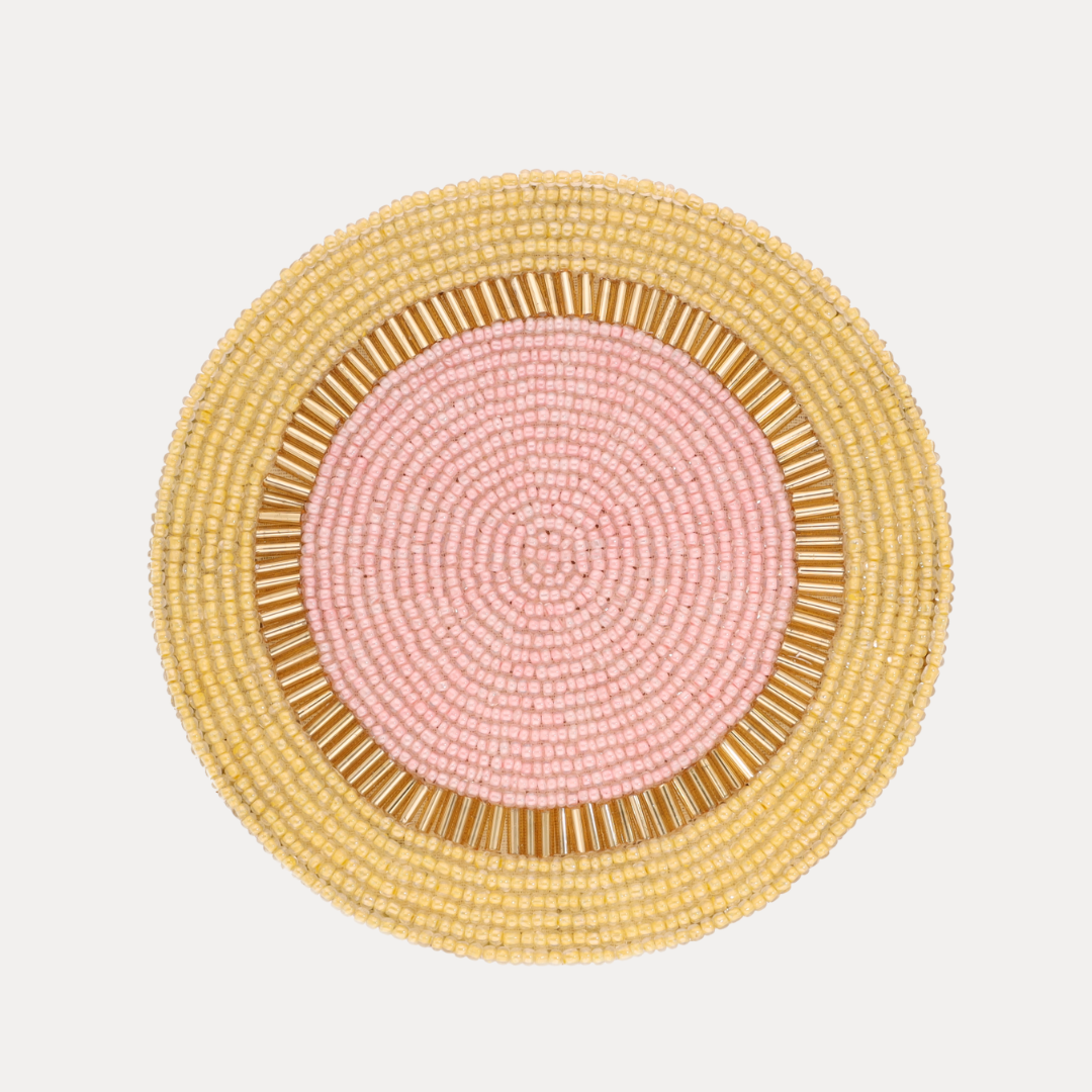 a close up of a beaded place mat
