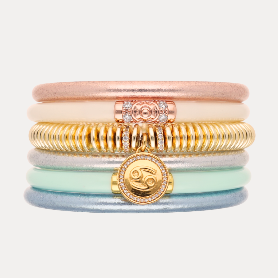 a stack of colorful bracelets