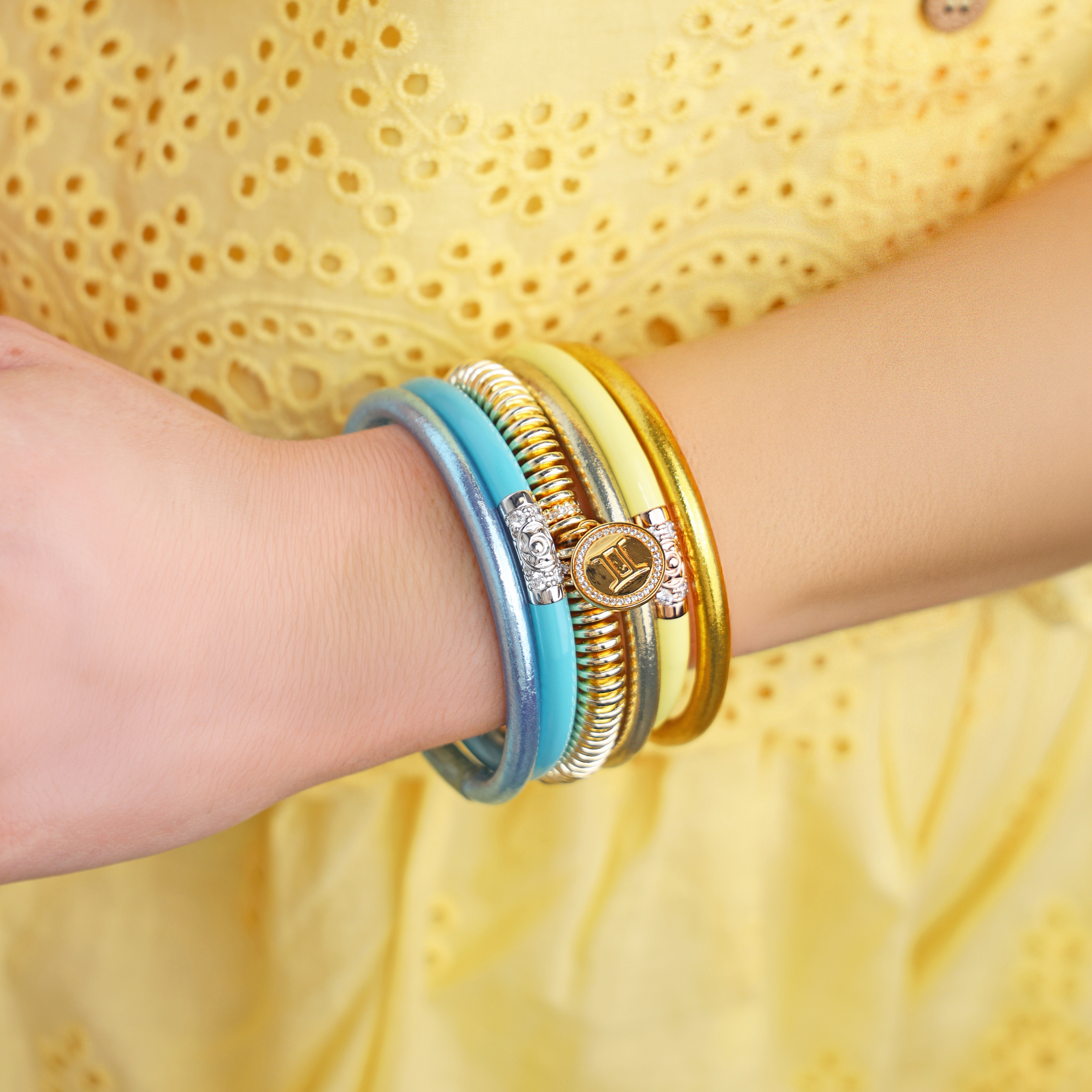 a person wearing bracelets on their wrist