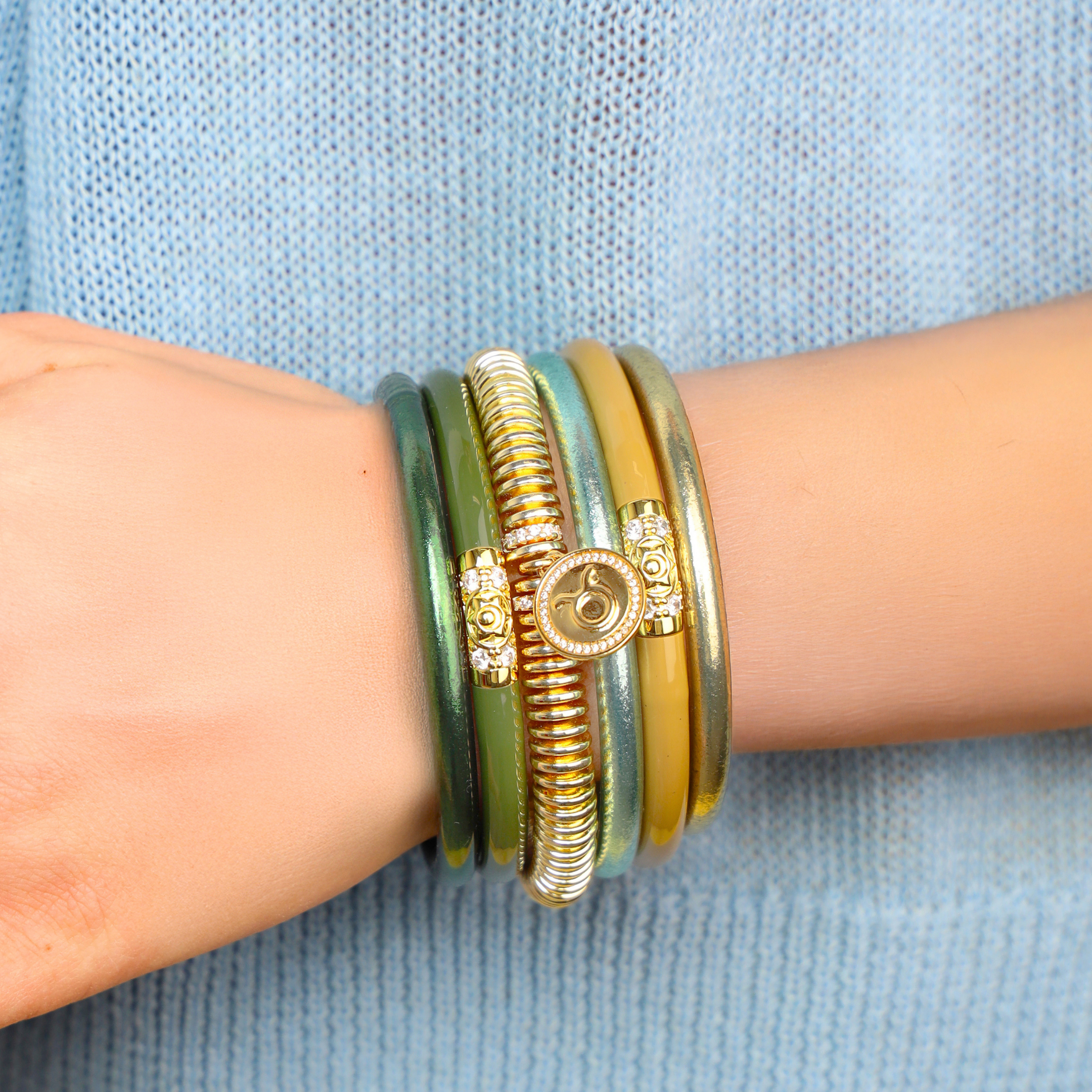 a person wearing bracelets on their wrist