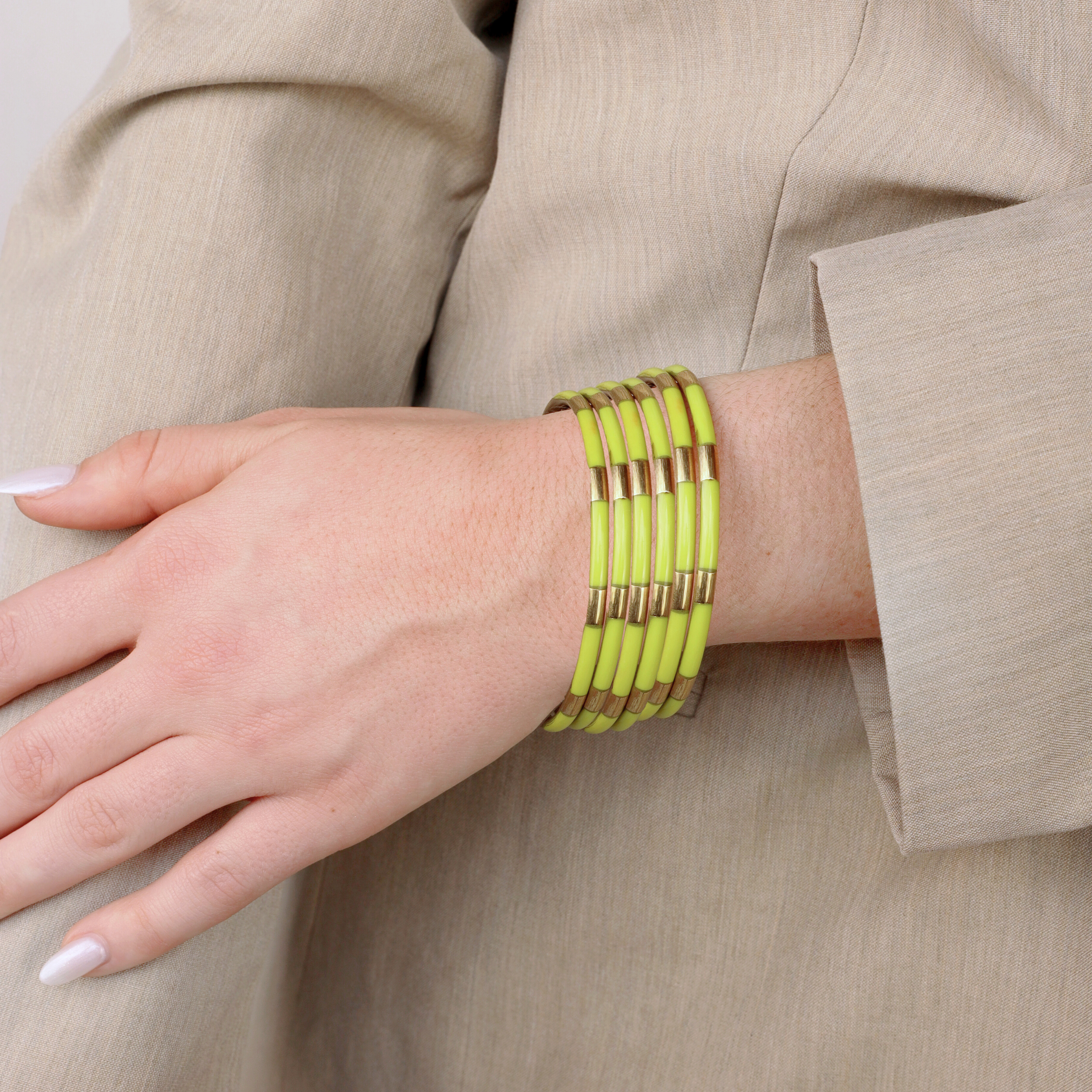 a woman wearing a yellow bracelet