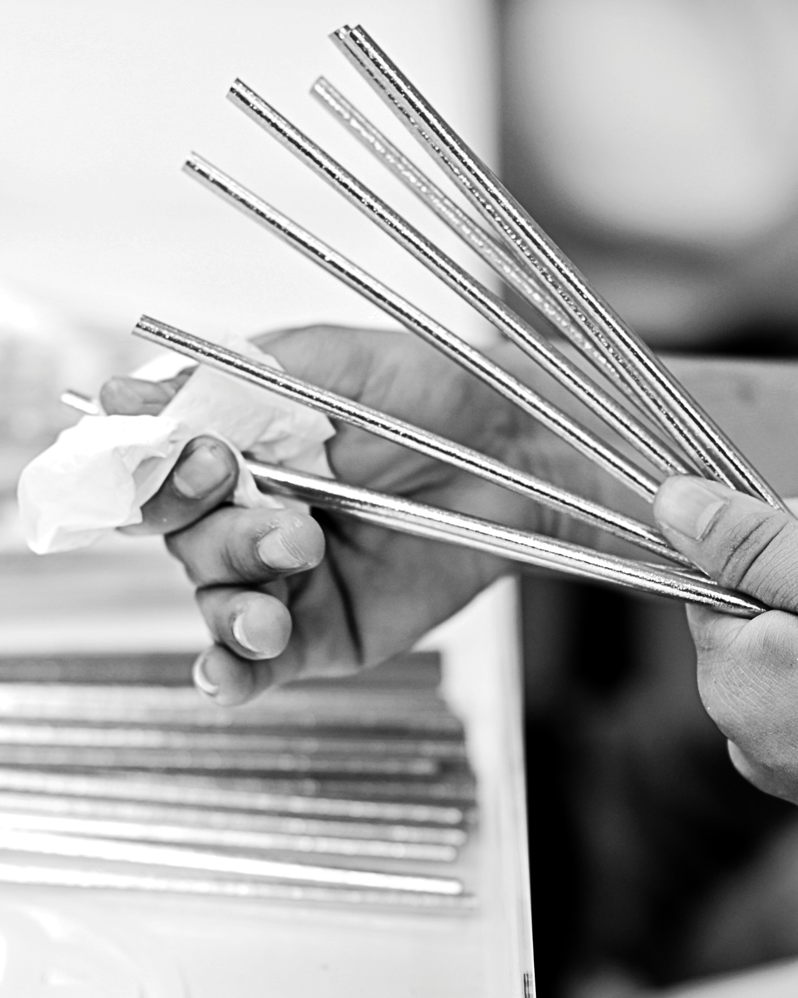 a person holding metal rods