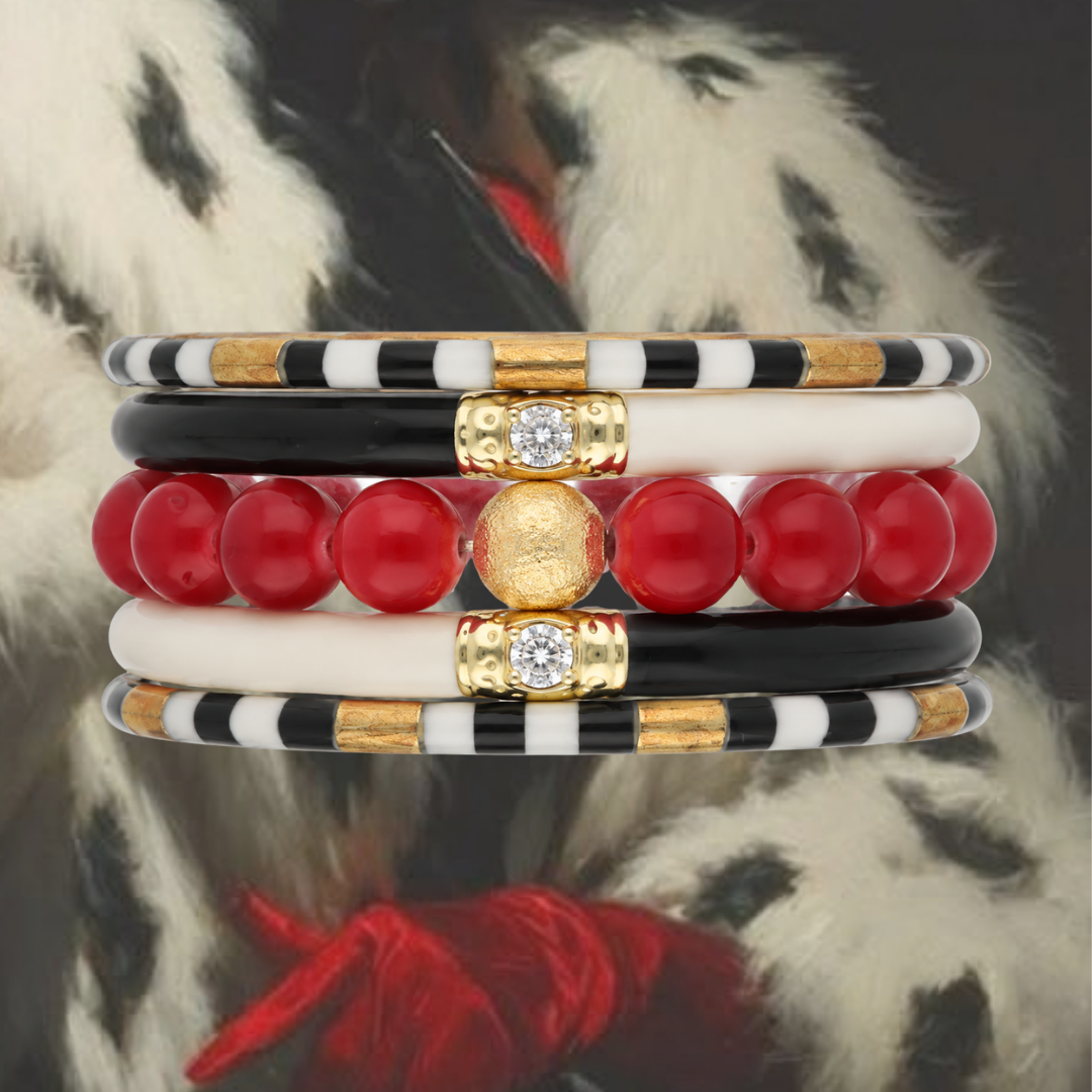 a stack of bracelets with red and black beads