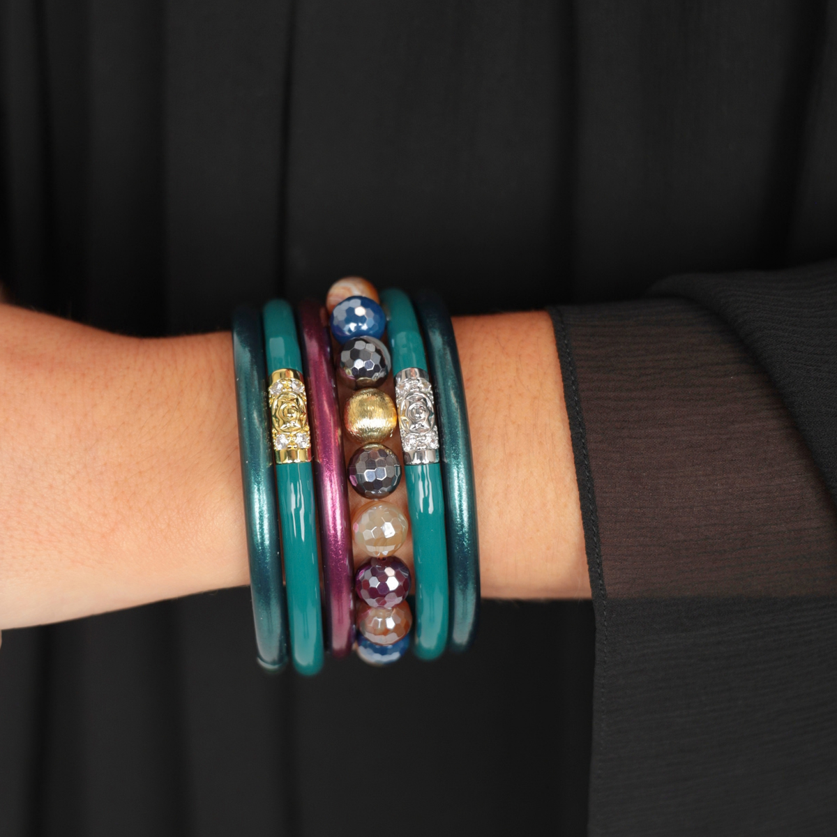 a person wearing bracelets on their wrist